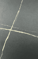A close-up shot of a light grey surface with subtle, lighter-colored veining, resembling a stone or quartz material.