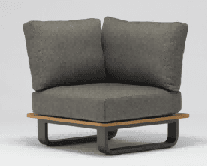 A small, rectangular side table with a textured, light brown top and a dark, C-shaped metal base.