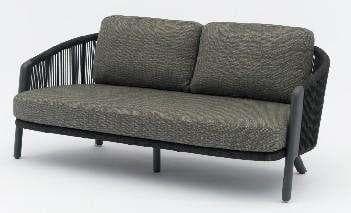 A light-colored outdoor chaise lounge with a woven backrest and wooden legs, featuring two cushions.